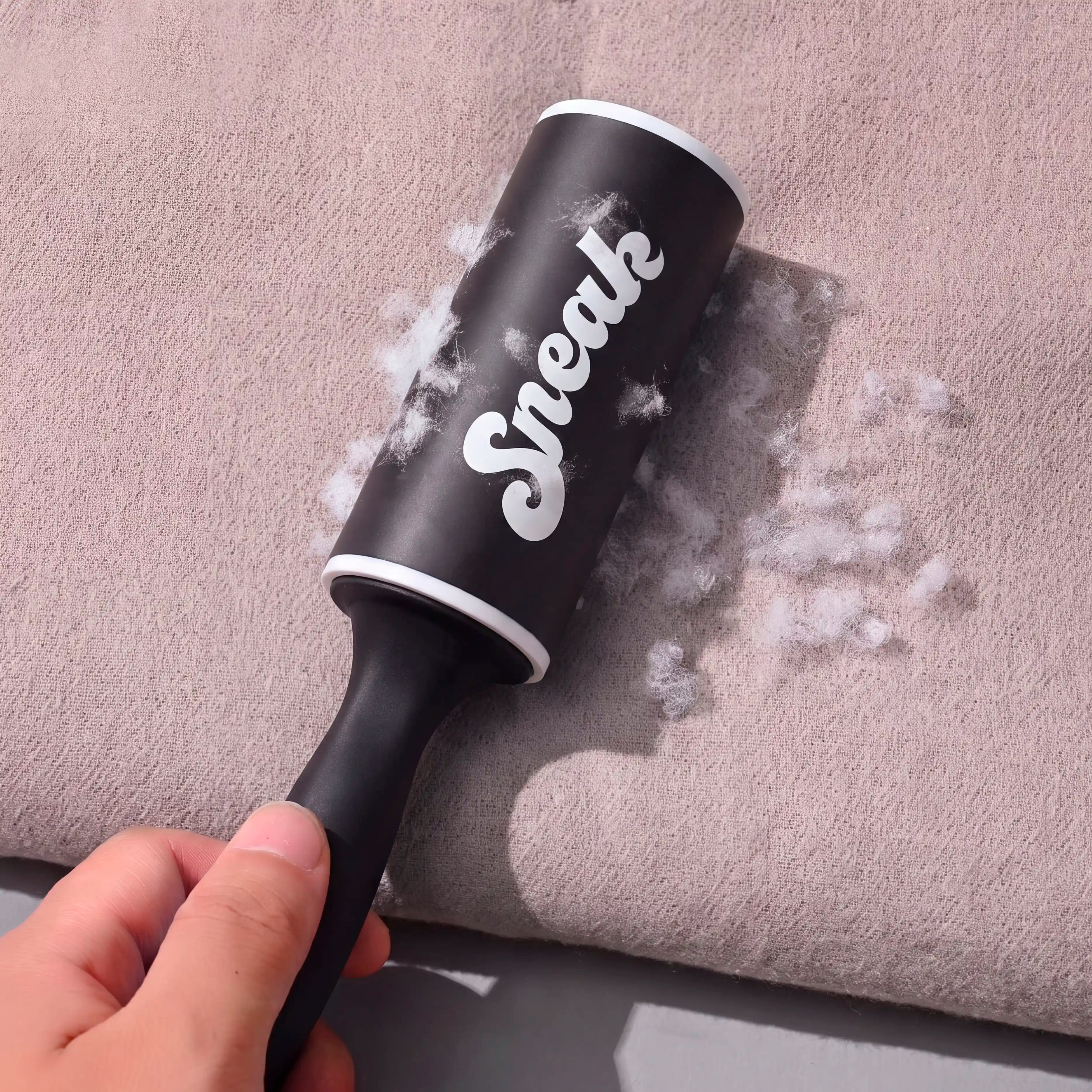 black sneak lint roller in use